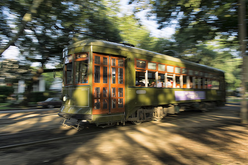 A traditional street car cruises through the Garden District - Blog A traditional street car cruises through the Garden District