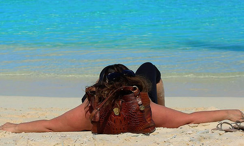 Joyce relaxing on a beach in her favorite destination, French Polynesia - Blog Joyce relaxing on a beach in her favorite destination, French Polynesia